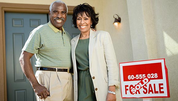 A happy family moving into their new home after a home inspection.