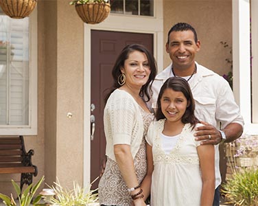 A happy family enjoying their new home after a buyer's home inspection.